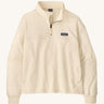 Patagonia women's Anya pullover. A cream lightweight pullover, features a 1/4 length zip, easy access side pockets and the logo patch stitched on the left chest.