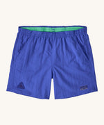 Patagonia women's baggies shorts in blue on a cream background.