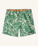Patagonia women's baggies shorts with a retro green leaf design on a cream background.