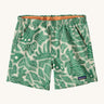 Patagonia women's baggies shorts with a retro green leaf design on a cream background.