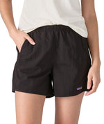 Patagonia women's baggies shorts in black worn by a woman front pocket detail 