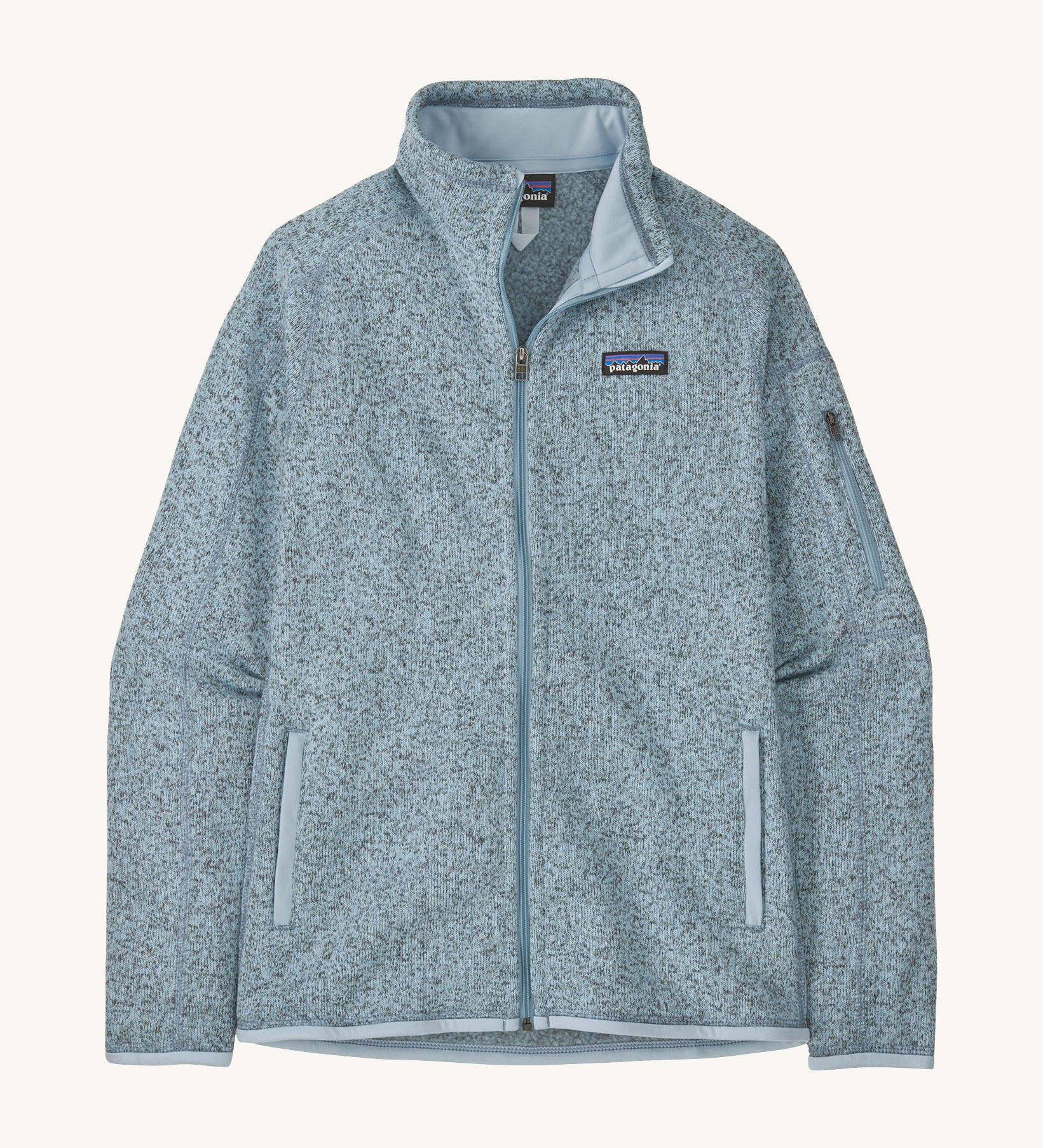 patagonia womens better sweater fleece in a light blue colour on a cream background.