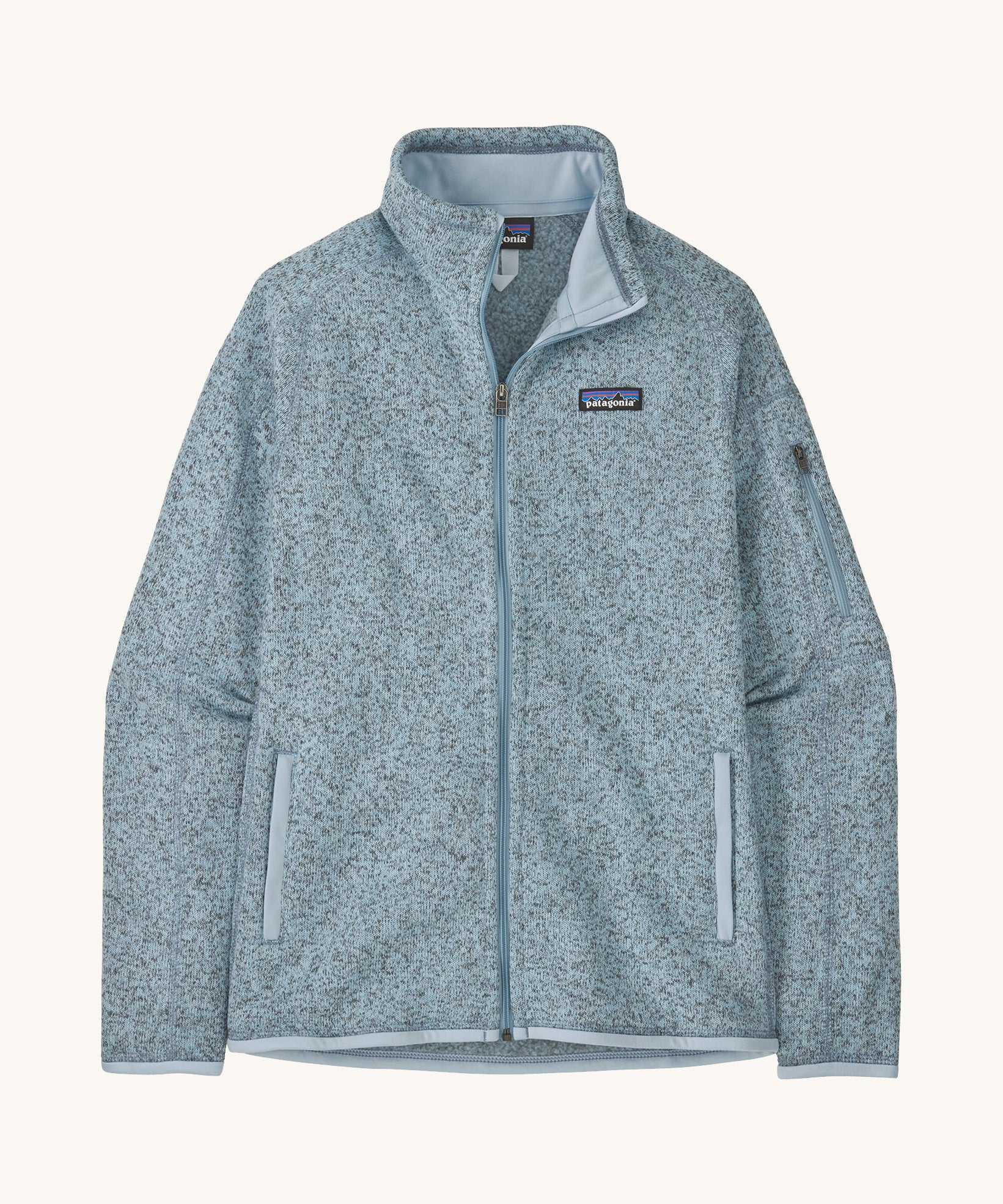 patagonia womens better sweater fleece in a light blue colour on a cream background.