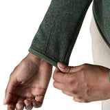 Woman wearing the Patagonia women’s better sweater fleece jacket in green. Close up of cufs.