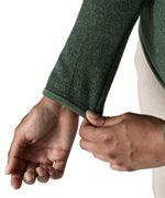 Woman wearing the Patagonia women’s better sweater fleece jacket in green. Close up of cufs.