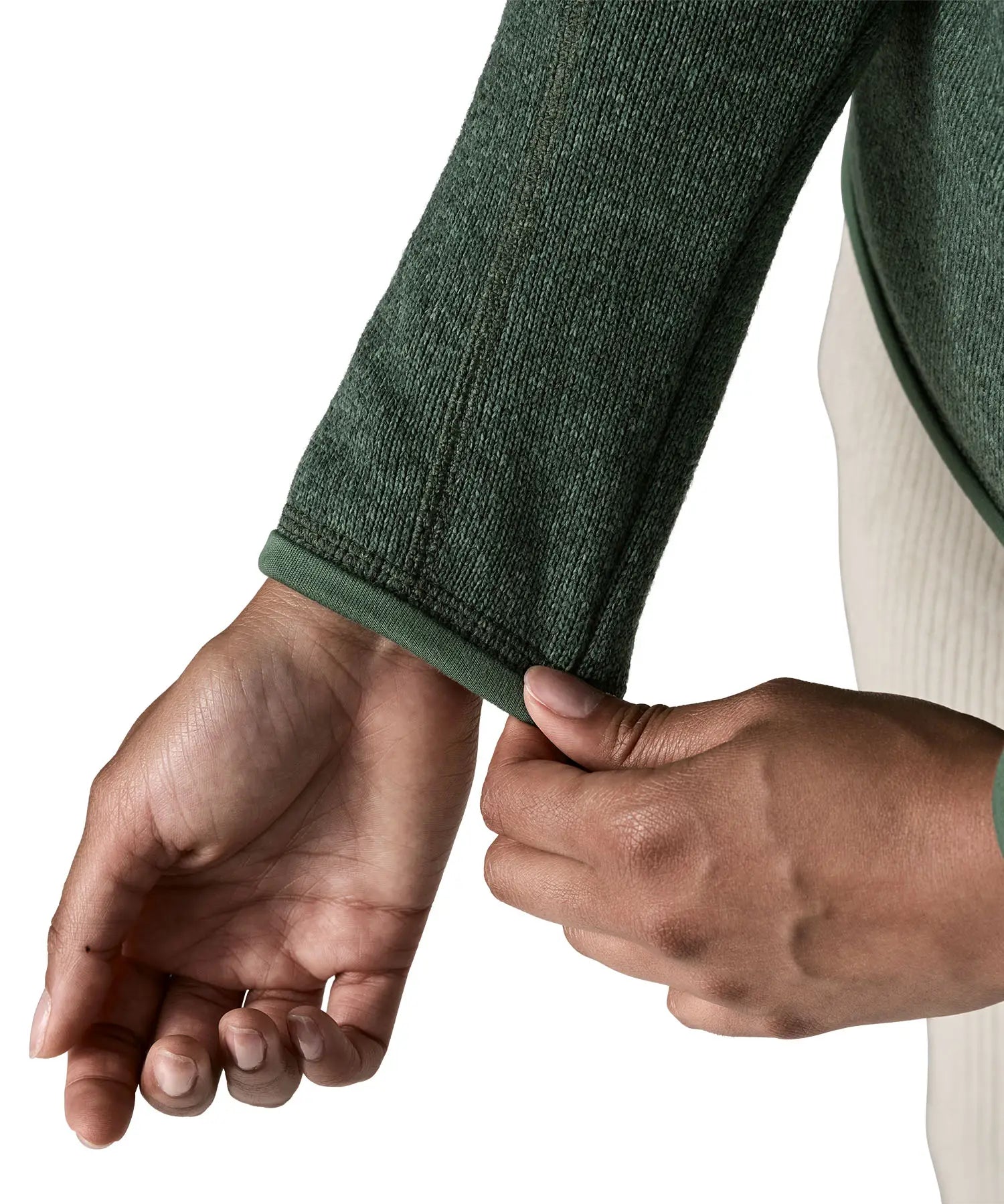 Woman wearing the Patagonia women’s better sweater fleece jacket in green. Close up of cufs.