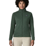 Woman wearing the Patagonia women’s better sweater fleece jacket in green. Full zip jacket with zipped arm pocket and handwarmer pockets.