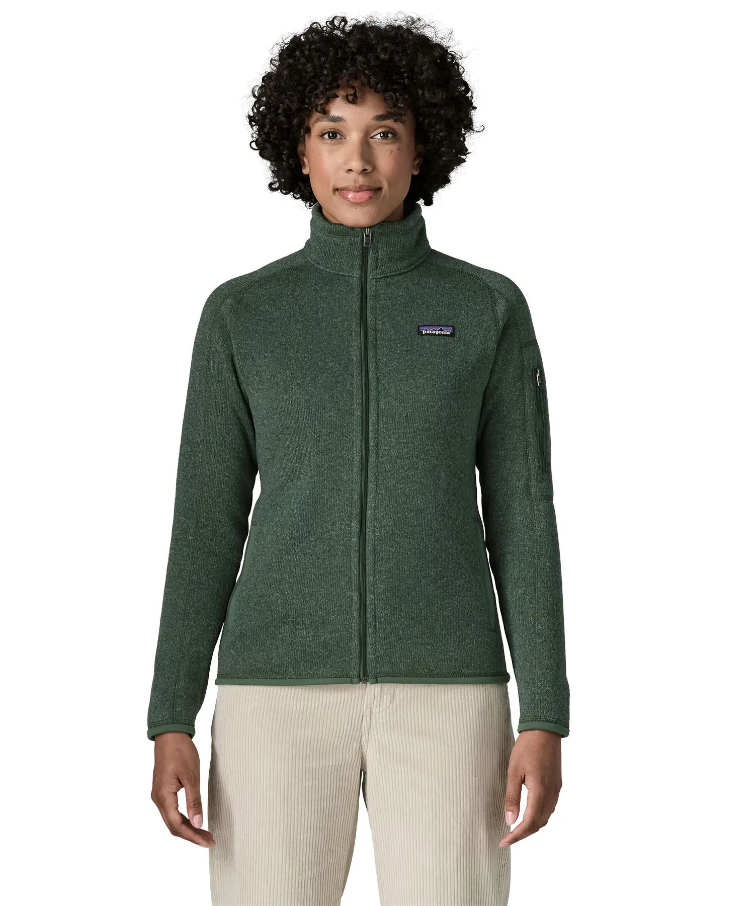 Woman wearing the Patagonia women’s better sweater fleece jacket in green. Full zip jacket with zipped arm pocket and handwarmer pockets.