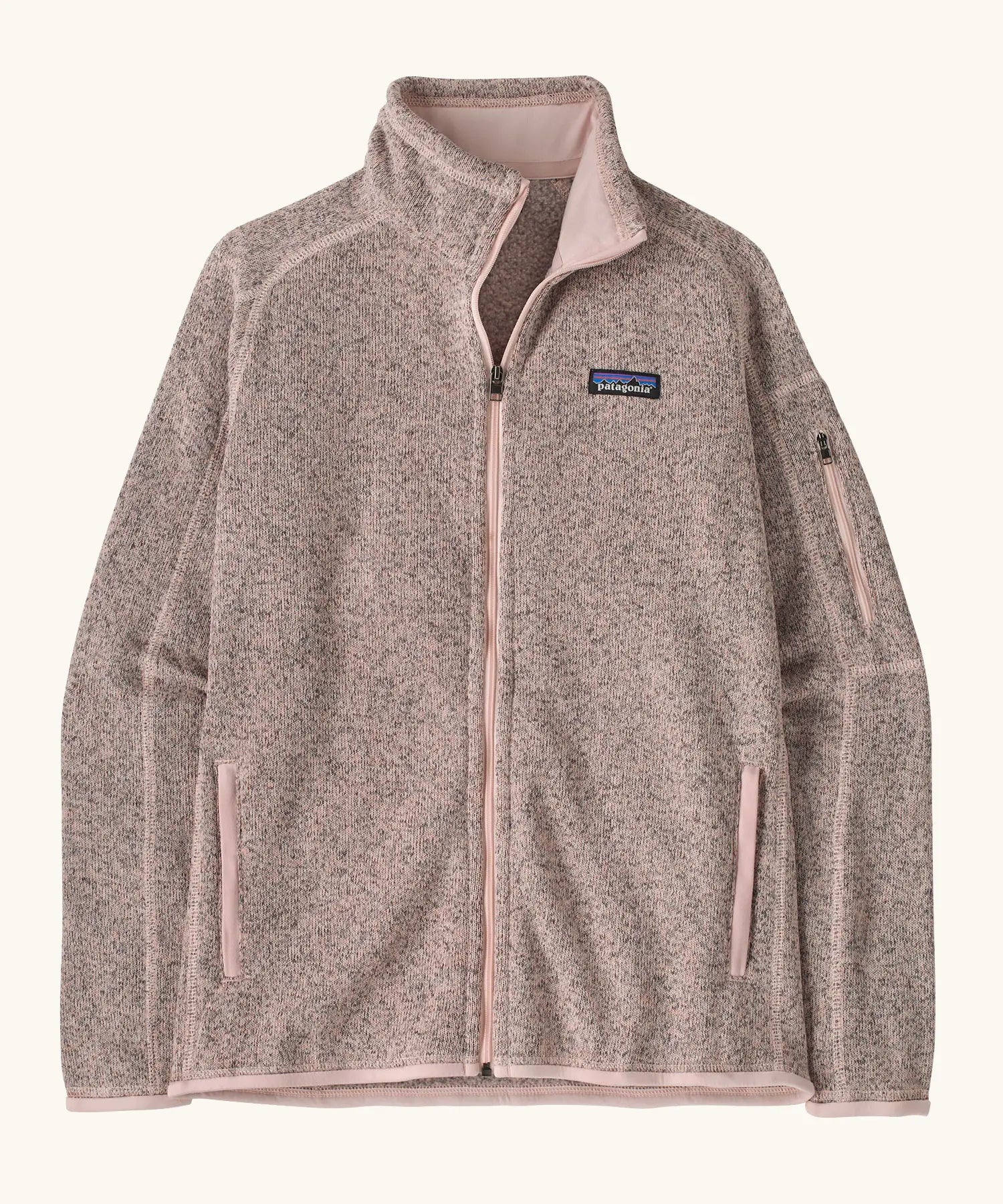 Patagonia women’s better sweater fleece jacket in pink frost. Full zip jacket with zipped arm pocket and handwarmer pockets.
