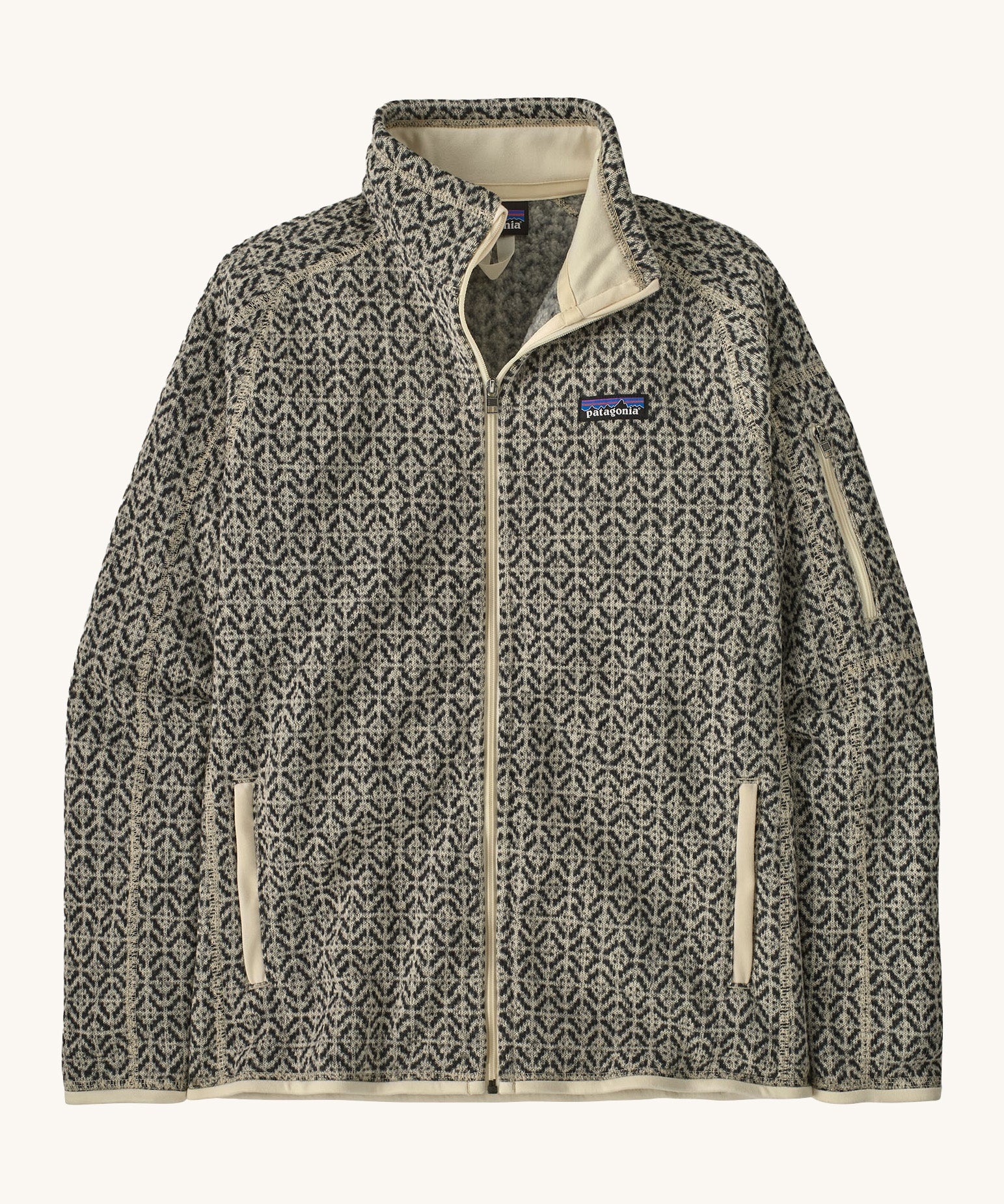 Patagonia women's better sweater jacket. A light fleece style jacket in natural colour with patterns. Features a full length zip with 2 side pockets and the logo patch stitched on the left chest. 