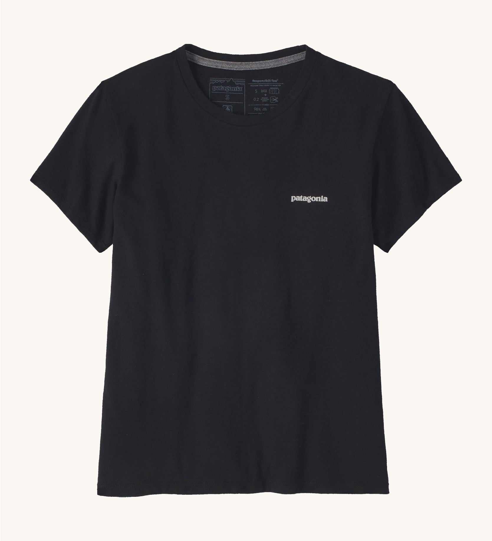Patagonia women's short sleeve top in black showing the logo text printed on the left chest