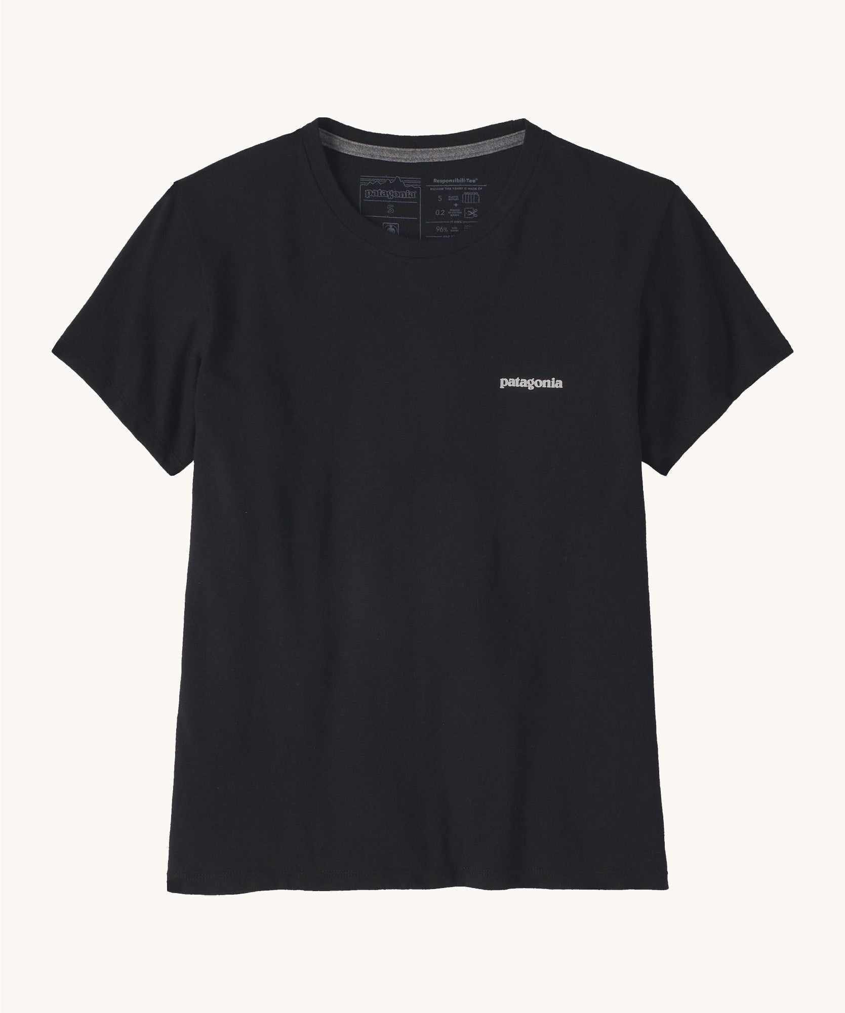 Patagonia women's short sleeve top in black showing the logo text printed on the left chest