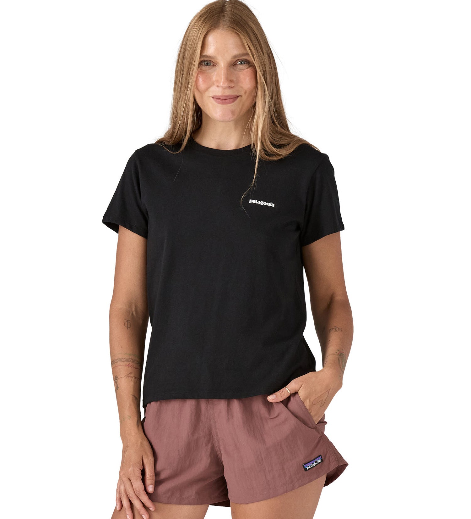 Patagonia women's black short sleeve t-shirt with logo worn by a woman