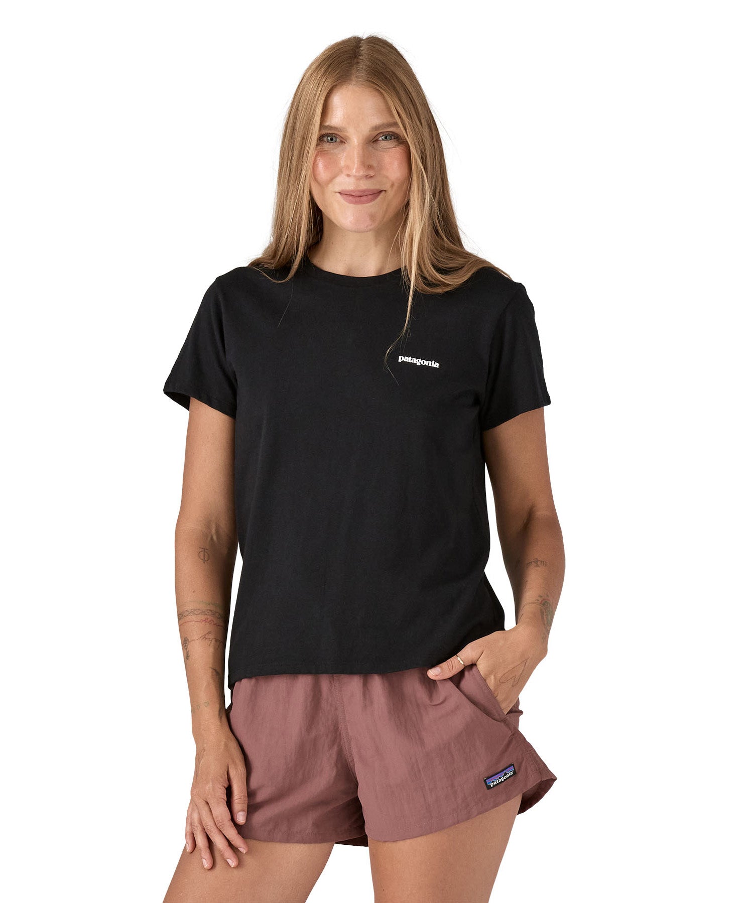 Patagonia women's black short sleeve t-shirt with logo worn by a woman