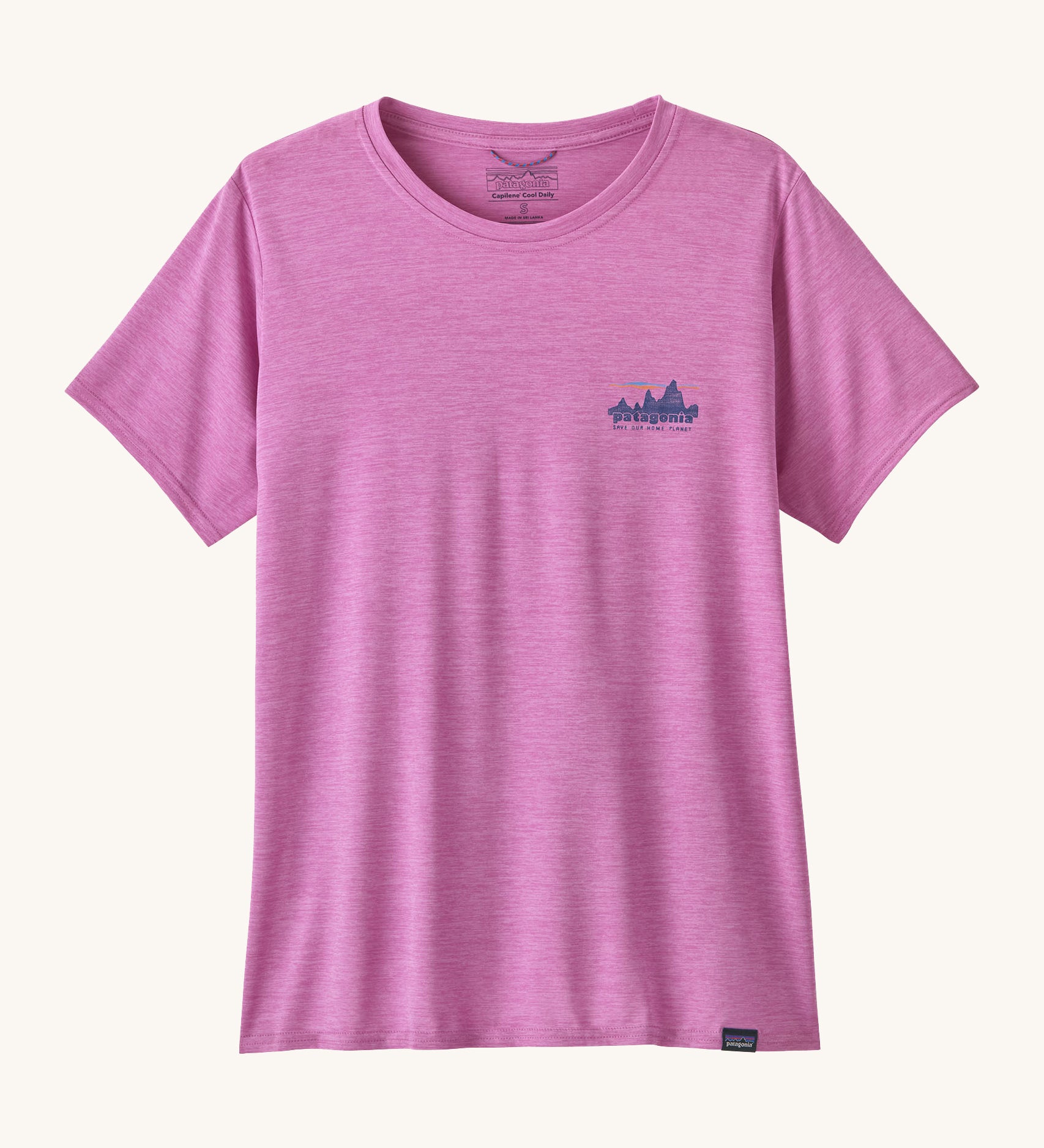 The front of the Patagonia Women's Capilene Cool Daily Graphic Shirt - '73 Skyline / Brisk Purple available at Babipur. A vibrant pink/purple top with short sleeves and a brand graphic on the chest
