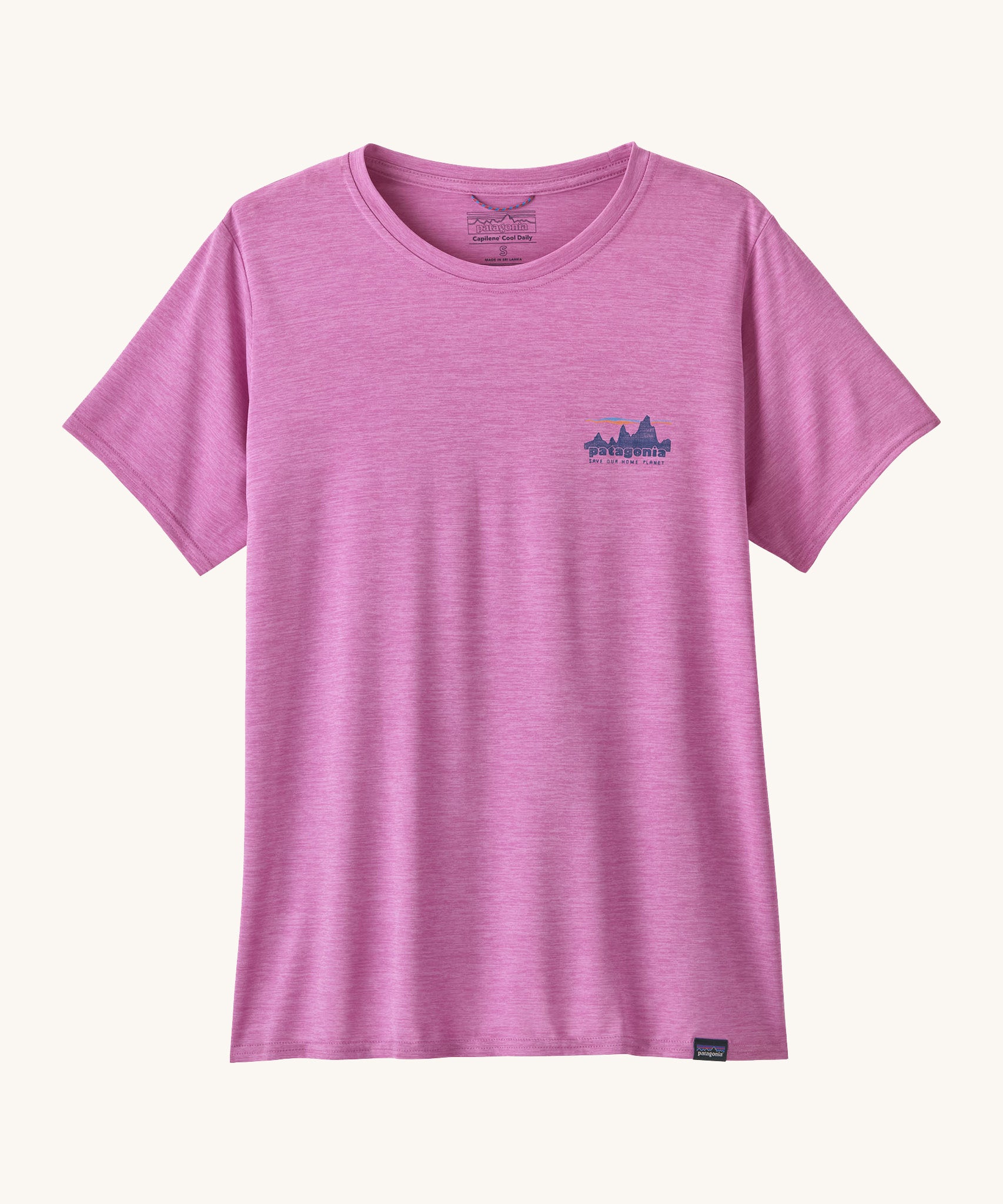 The front of the Patagonia Women's Capilene Cool Daily Graphic Shirt - '73 Skyline / Brisk Purple available at Babipur. A vibrant pink/purple top with short sleeves and a brand graphic on the chest