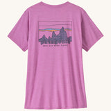 Patagonia Women's Capilene Cool Daily Graphic Shirt - '73 Skyline / Brisk Purple is a vibrant pink/purple top with short sleeves and a big brand graphic printed on the back.