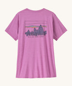 Patagonia Women's Capilene Cool Daily Graphic Shirt - '73 Skyline / Brisk Purple is a vibrant pink/purple top with short sleeves and a big brand graphic printed on the back.