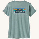 Patagonia Women's Cap Cool Daily Graphic Shirt in a Waters Thermal Blue colour on a plain background showing the back of the t-shirt