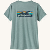 Patagonia Women's Cap Cool Daily Graphic Shirt in a Waters Thermal Blue colour on a plain background showing the back of the t-shirt