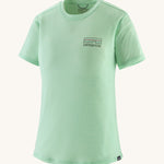 patagonia women's capilene short sleeve top in light green on a cream background. 