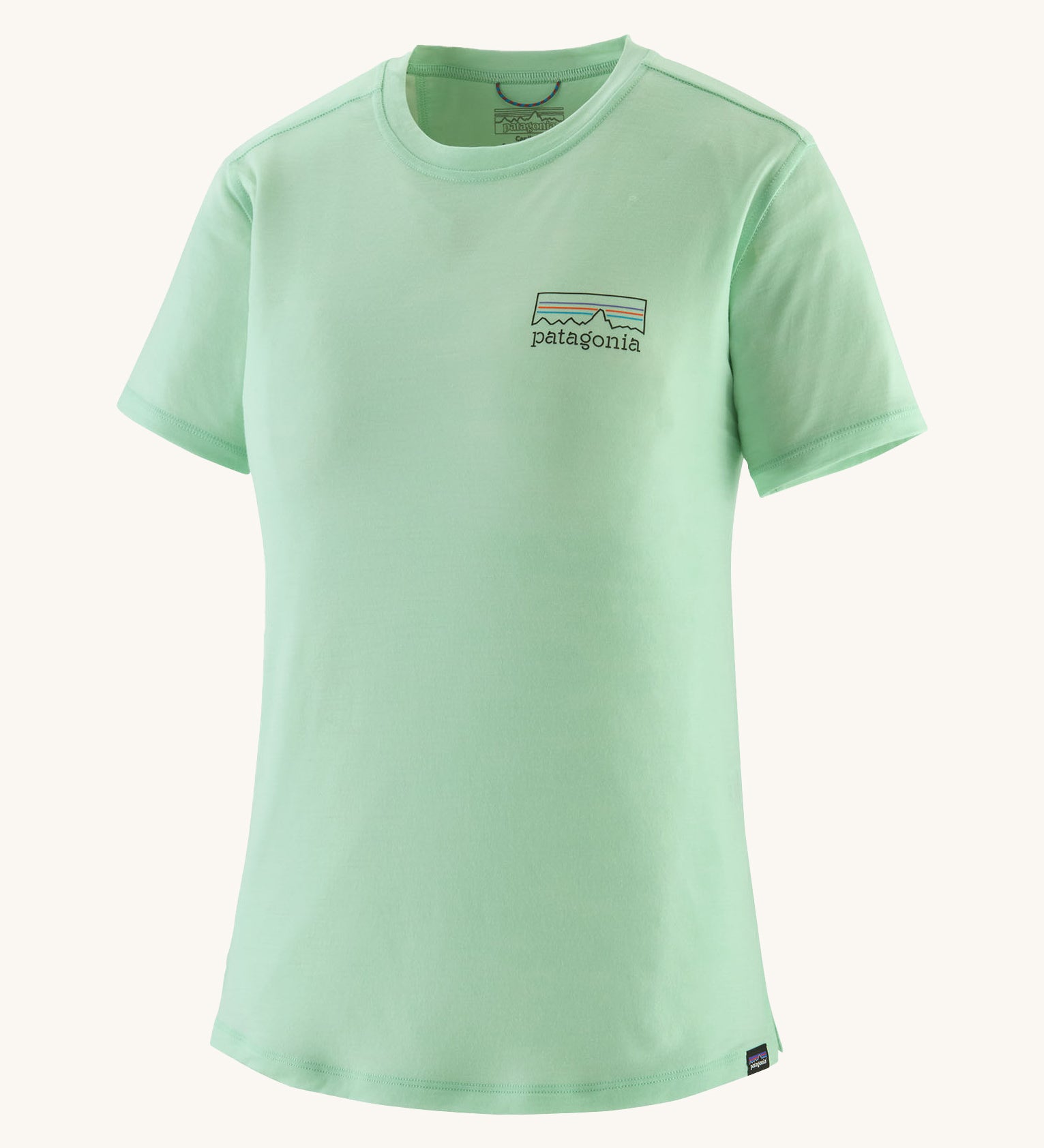 patagonia women's capilene short sleeve top in light green on a cream background. 