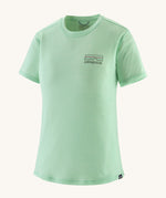 patagonia women's capilene short sleeve top in light green on a cream background. 