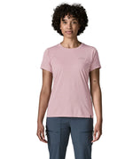 Woman wearing the Patagonia women's capilene cool daily shirt with P-6 Cosmos logo in Fuzzy Mauve pink with Light Fuzzy Mauve X-Dye material.