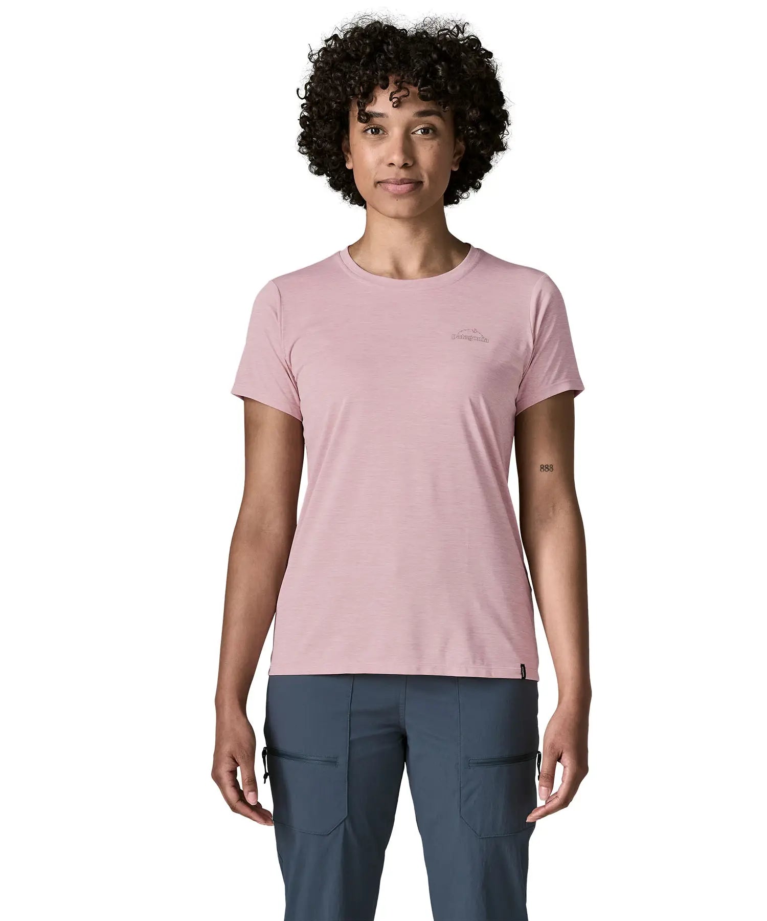 Woman wearing the Patagonia women's capilene cool daily shirt with P-6 Cosmos logo in Fuzzy Mauve pink with Light Fuzzy Mauve X-Dye material.