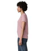 Side of woman wearing the Patagonia women's capilene cool daily shirt with P-6 Cosmos logo in Fuzzy Mauve pink with Light Fuzzy Mauve X-Dye material.