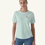 A woman wearing the Patagonia Women's Capilene Cool Trail Graphic Shirt in a Wispy Green colour. 