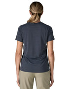 Back of of woman wearing Patagonia women's capilene cool ultra short sleeve t-shirt in navy. T-shirt has a relaxed fit