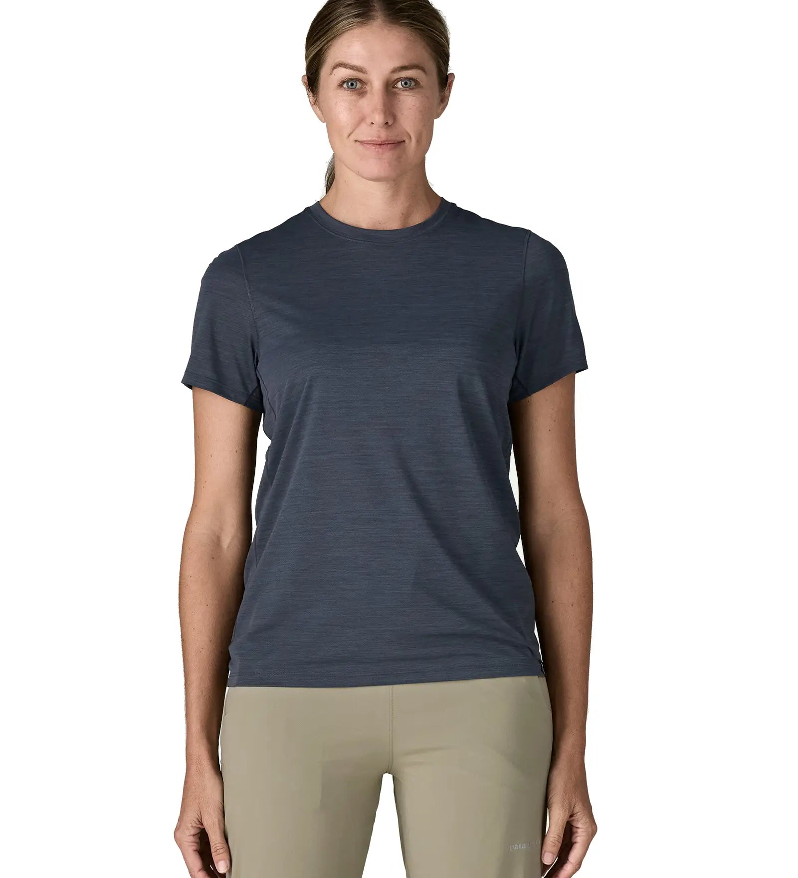 Front of woman wearing Patagonia women's capilene cool ultra short sleeve t-shirt in navy