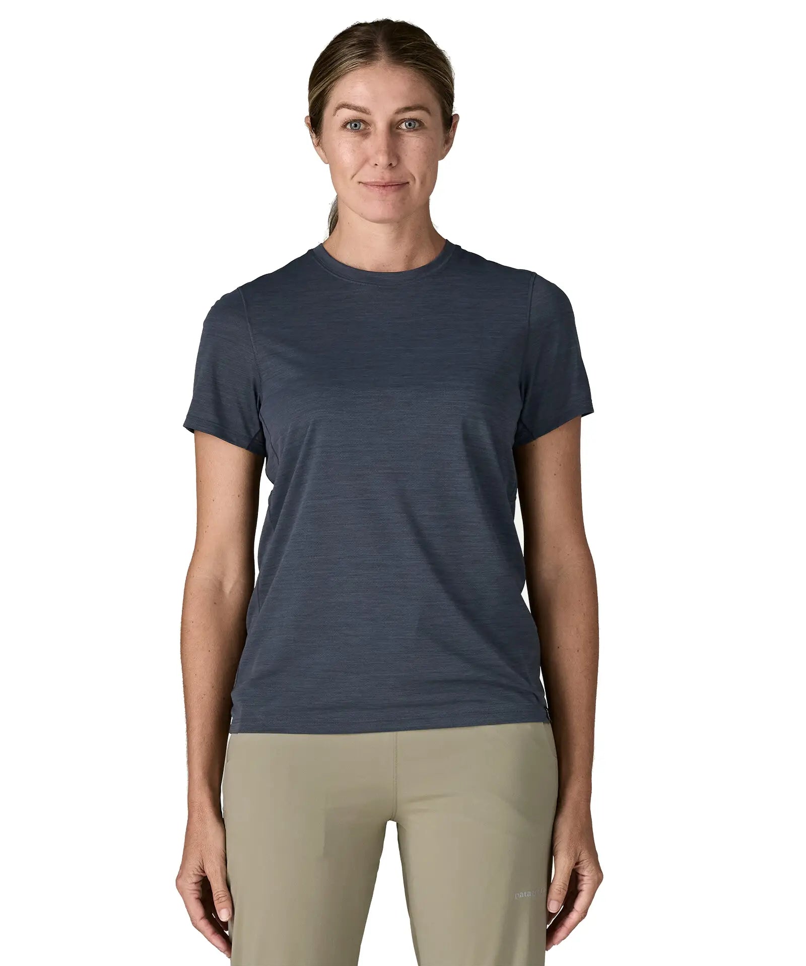 Front of woman wearing Patagonia women's capilene cool ultra short sleeve t-shirt in navy
