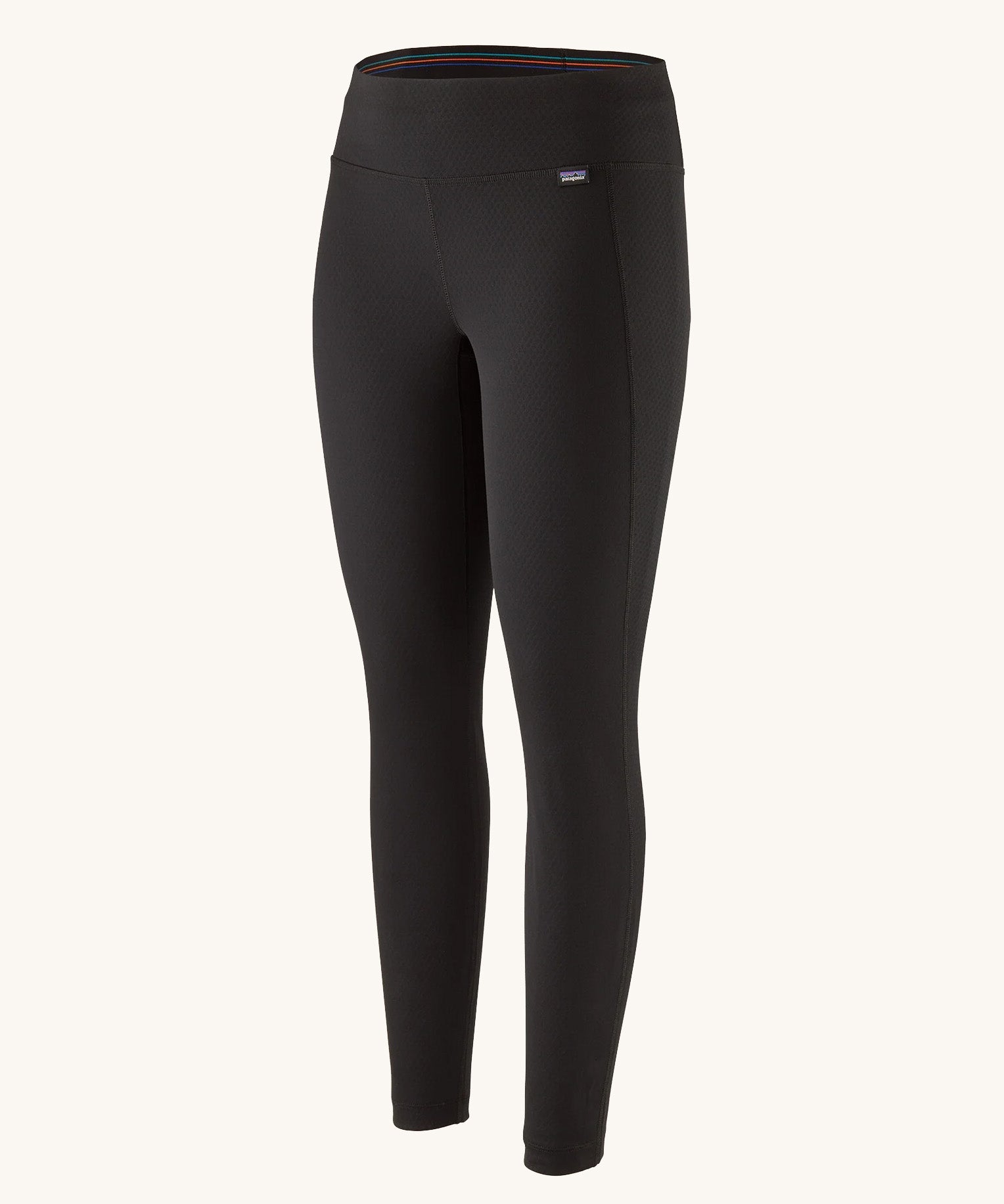 Patagonia Women's Capilene® Midweight Bottoms in black with diamond grid pattern for warmth and breathability.