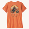 Patagonia women's capilene short sleeve top in a light orange colour with a mountain crest design on a cream background.