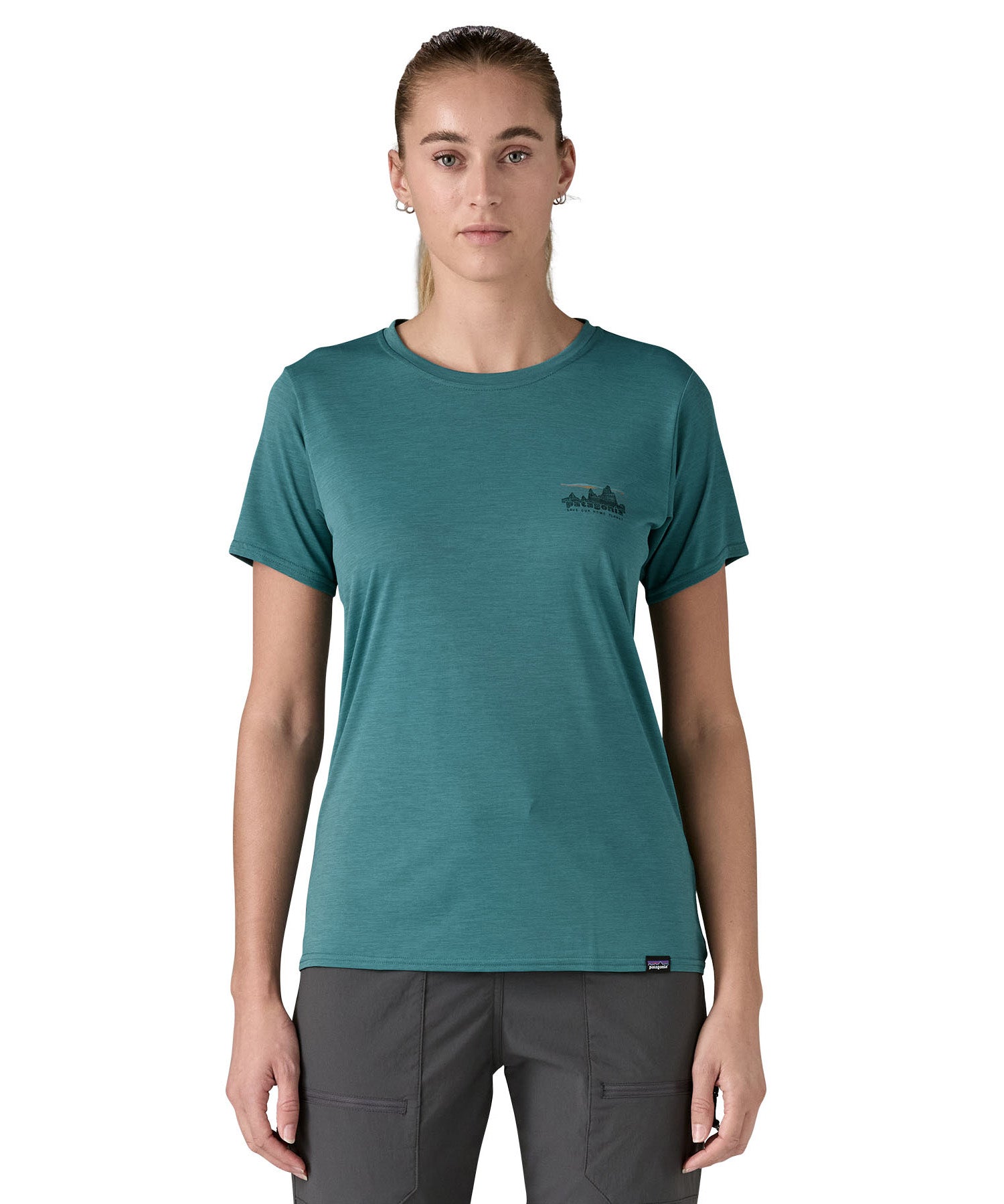 patagonia women's capilene top in a turquoise colour with logo design worn by a woman front detail