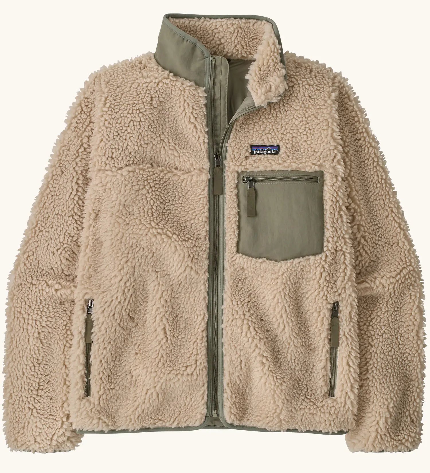 Patagonia Women's Classic Retro-X® fleece jacket in dark natural with green detailing.  Turn up collar, full length zip, 2 side handwarmer pockets and a green easy access chest pocket. 