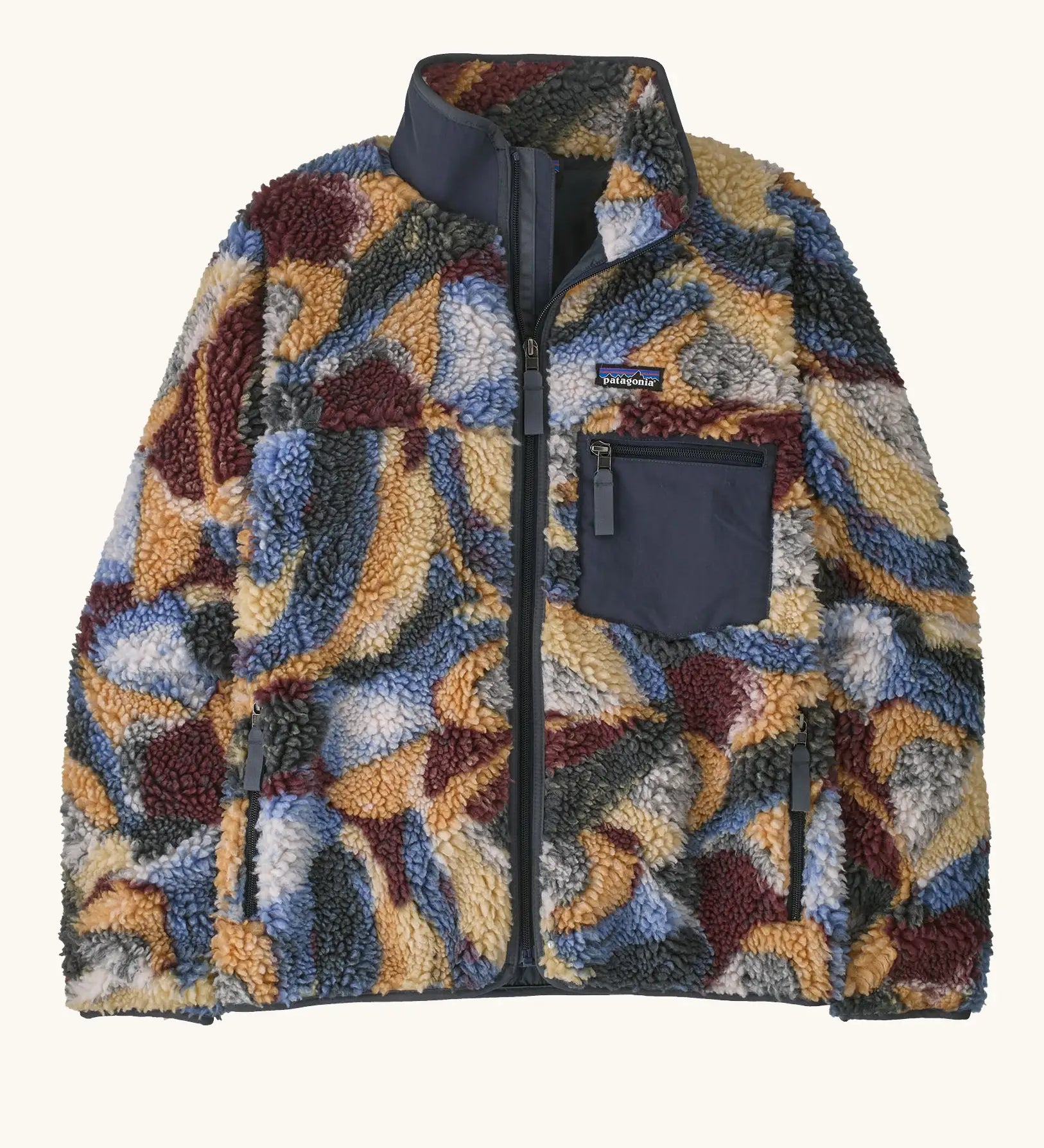 Patagonia women's classic Retro-X® fleece jacket with smudge pattern on blue. Turn up collar, full length zip, 2 side handwarmer pockets and an easy access chest pocket. 