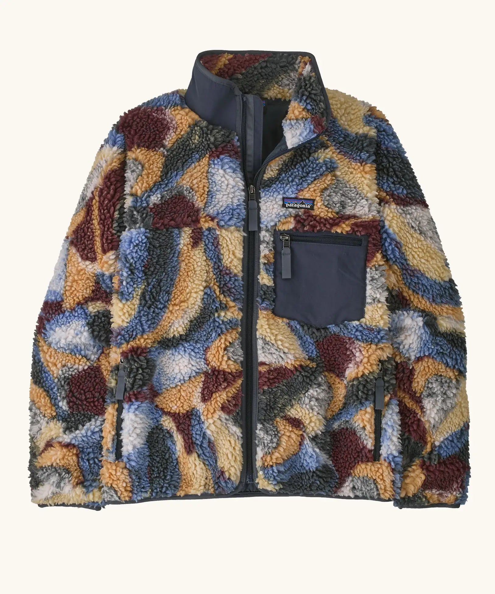 Patagonia women's classic Retro-X® fleece jacket with smudge pattern on blue. Turn up collar, full length zip, 2 side handwarmer pockets and an easy access chest pocket. 