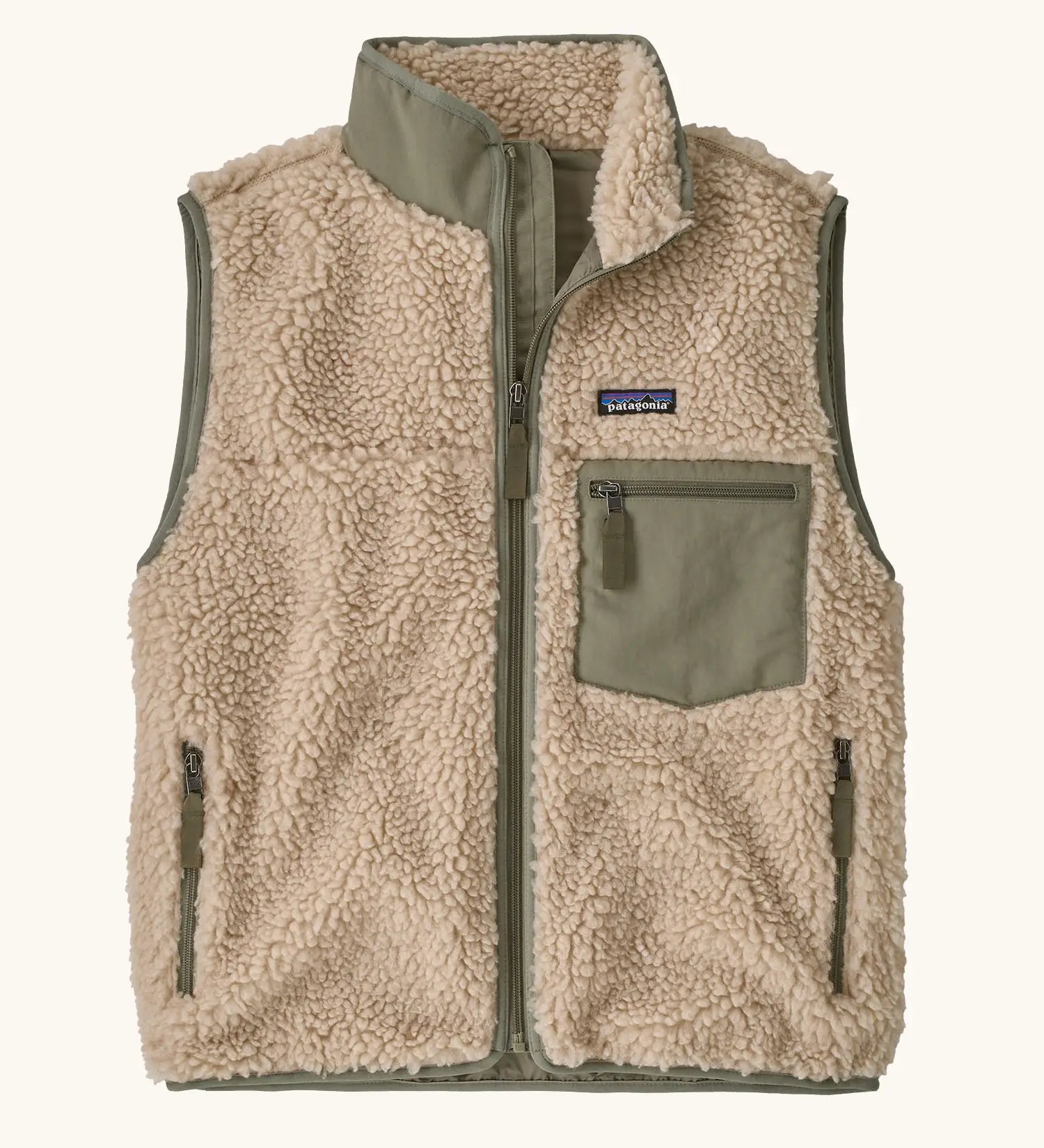 Patagonia women's classic retro-x fleece vest gilet in dark natural with river rock green detailing and zipped chest pocket. 