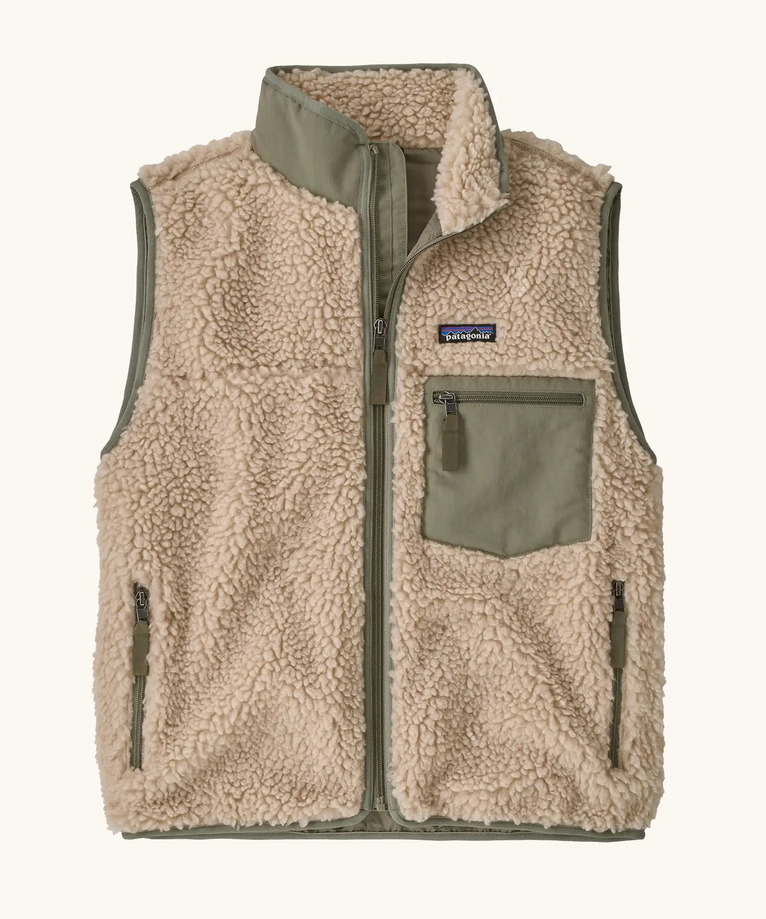 Patagonia women's classic retro-x fleece vest gilet in dark natural with river rock green detailing and zipped chest pocket. 
