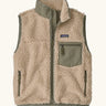 Patagonia women's classic retro-x fleece vest gilet in dark natural with river rock green detailing and zipped chest pocket. 