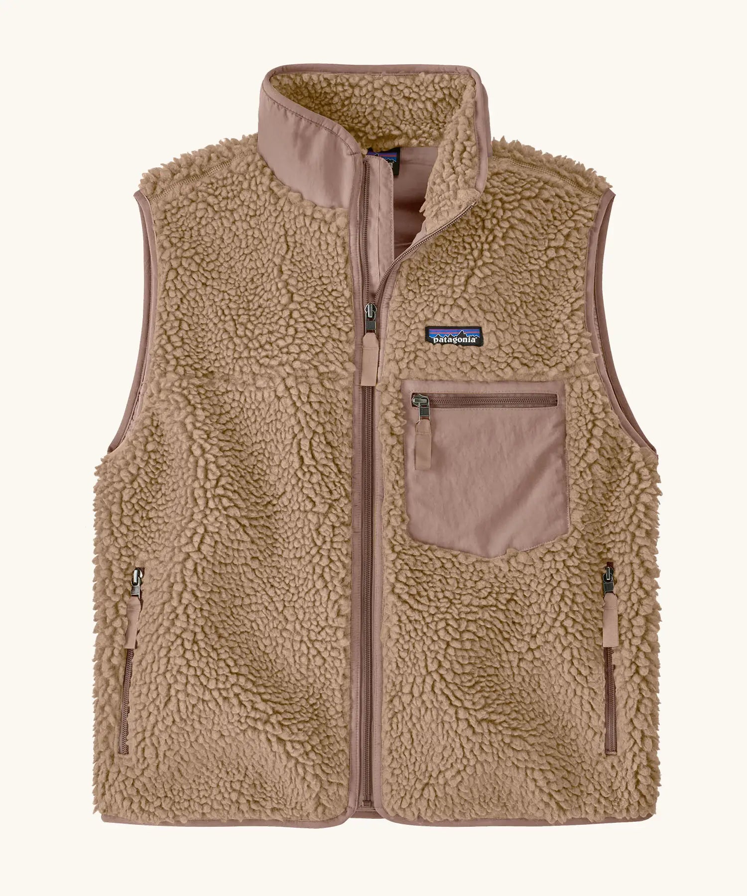 Patagonia women's classic retro-x® fleece vest gilet in oar tan with pale pink chest pocket, collar and zip details.  Full zip up front with zipped handawarmer pocket and zipped pale pink chest pocket.