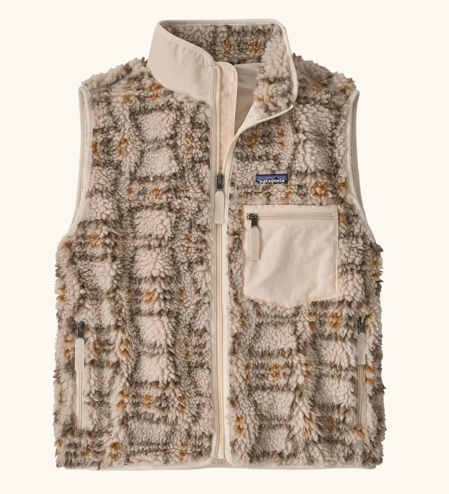 Patagonia women's classic Retro-X® fleece vest with a snowshoe hare pattern on natural. Full zip up front with zipped handwarmer pockets and zipped chest pocket.