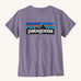 Patagonia women's short sleeve top in light purple back logo detail on a cream background.