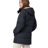 A view of the back of a woman wearing the Patagonia Women's Cotton Down Parka - Pitch Blue