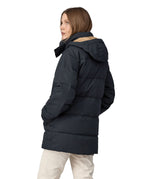 A view of the back of a woman wearing the Patagonia Women's Cotton Down Parka - Pitch Blue