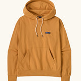 Patagonia women's cotton daily hoody in dried mango yellow with set-in sleeves, double lined hood, marsupial pocket and Patagonia® P-6 logo at the left chest. 