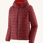 Patagonia Women's Down Sweater Hoody in a Oxide Red colour on a plain bacnground. 
